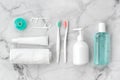Set of pink and turquoise blue toothbrushes, toothpaste and other tools on marble background. Royalty Free Stock Photo