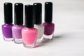 Set of pink and violet colorful nail polish bottles Royalty Free Stock Photo