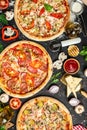 Set Pizza background. various kinds of Italian pizza on a dark background, Fast food lunch, vertical image. top view. place for