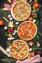 Set Pizza background. various kinds of Italian pizza on a dark background, Fast food lunch, vertical image. top view. place for