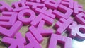 Set of plastic alphabet letters placed on a wooden floor Royalty Free Stock Photo