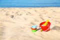 Set of plastic beach toys on sand near sea. Space for Royalty Free Stock Photo