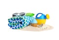 Set of plastic beach toys, towel, sunglasses and pile of sand Royalty Free Stock Photo