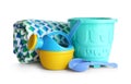 Set of plastic beach toys and towel on white Royalty Free Stock Photo