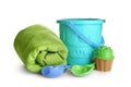 Set of plastic beach toys and towel on white Royalty Free Stock Photo