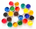 Set of plastic cans with colored paints, white background, top view Royalty Free Stock Photo