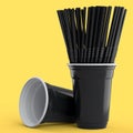 Set of plastic disposable party cups for coffee with heap straw on yellow