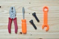 Set of plastic toy tools over wooden Royalty Free Stock Photo