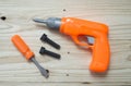 Set of plastic toy tools over wooden Royalty Free Stock Photo