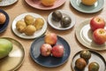 set of plates full of different fruits and vegetables on oak table, pears,