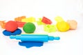 Set of play dough and plastic cutting block on white Royalty Free Stock Photo