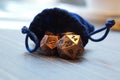 A set of polyhedral dice with a draw string bag Royalty Free Stock Photo