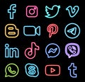 Set of popular logos in neon design: Facebook, Instagram, Twitter, Youtube, WhatsApp, and others. Vector illustration