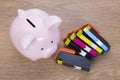 Set of printer ink cartridges with a piggy bank Royalty Free Stock Photo