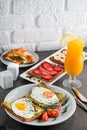 A set of products for a delicious European Breakfast Scrambled eggs, croissants and orange juice Royalty Free Stock Photo