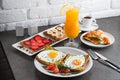 A set of products for a delicious European Breakfast Scrambled eggs, croissants and orange juice Royalty Free Stock Photo