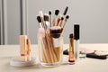 Set of professional brushes and makeup products on wooden table indoors Royalty Free Stock Photo