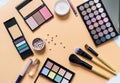 Set of professional decorative cosmetics, makeup tools and accessory on yellow background. Beauty, fashion, party and shopping Royalty Free Stock Photo