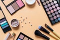 Set of professional decorative cosmetics, makeup tools and accessory on yellow background. Beauty, fashion, party and shopping Royalty Free Stock Photo