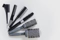 Set of professional hairbrushes on white background in hair salon