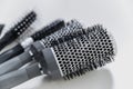 Set of professional hairbrushes on white background in hair salon