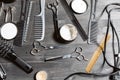 Set of professional hairdresser tools on grey background. Wooden table in barbershop. Working tool of barber master Royalty Free Stock Photo