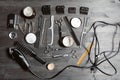 Set of professional hairdresser tools on grey background. Wooden table in barbershop. Working tool of barber master Royalty Free Stock Photo