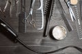 Set of professional hairdresser tools on grey background. Wooden table in barbershop. Working tool of barber master Royalty Free Stock Photo