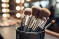 Set of professional makeup brushes in holder, closeup and a shallow depth of field - generated by ai Royalty Free Stock Photo