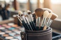 Set of professional makeup brushes in holder, closeup and a shallow depth of field - generated by ai Royalty Free Stock Photo