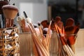 Set of professional makeup brushes near mirror on wooden table, closeup Royalty Free Stock Photo