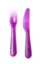 Purple baby plastic fork and knife on white background