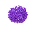 Set of purple diamonds for diamond embroidery isolated on white background. Hobbies and DIY, materials for creating