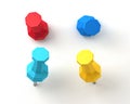 Set of push pins in different colors, with real shadows, isolated on white background. Royalty Free Stock Photo