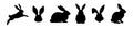 Set of Rabbit silhouettes. Easter bunnies. Isolated on a white backdrop. A simple black icons of hares. Cute animals Royalty Free Stock Photo