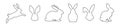 Set of rabbits in outline. Easter bunnies. Isolated on a white background. A simple black icons of hares. Cute animals Royalty Free Stock Photo