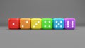 Set of rainbow colored dices on the gray background. Colorful play dice with numbers. Casino gamble playing tool. 3D render