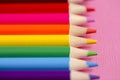 Set of Rainbow Colored Pencils on a Bright Pink Background Royalty Free Stock Photo