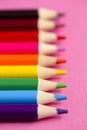 Set of Rainbow Colored Pencils on a Bright Pink Background Royalty Free Stock Photo