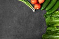Set of Raw organic food, vegetables with fresh ingredients for healthily cooking on black  background, top view, banner. Vegan or Royalty Free Stock Photo