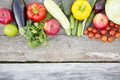 Set of raw organic fruits and vegetables on dark wooden background. Copy space. Top view. From above. Royalty Free Stock Photo