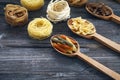 A set of raw pastas on spoons on a wooden table Royalty Free Stock Photo