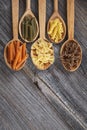 A set of raw pastas on spoons on a wooden table Royalty Free Stock Photo