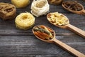 A set of raw pastas on spoons on a wooden table Royalty Free Stock Photo