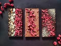 Set of real Belgian handmade chocolate with berries and nuts using natural dyes Royalty Free Stock Photo