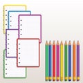 Set of realistic colorful spiral notebook with blank squared paper pages and row of color pencils isolated on white background. De
