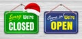 Set of realistic information boards christmas twigs with the sign come in we are open and sorry we are closed.