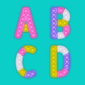 A set of realistic pop it toys in the form of an alphabet.