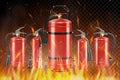 Set of realistic red extinguishers isolated on burning background: different types of handle extinguishers, water, carbon dioxide