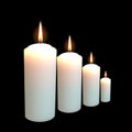 Set of realistic wax round shape candle different sizes isolated in black background. Vector candles collection set.